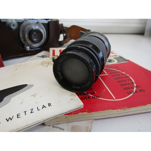 16 - Leica camera with a lens and instruction booklets
