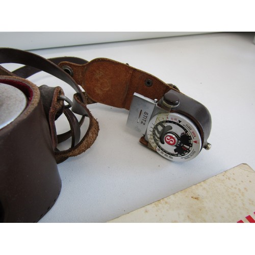 16 - Leica camera with a lens and instruction booklets