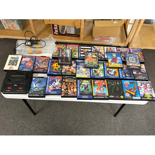 436 - Sega Megadrive 2 with two controllers, cables and an assortment of games
