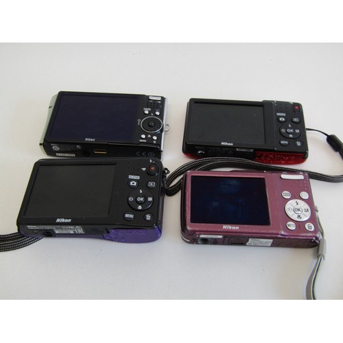 44 - Four Nikon CoolPix digital cameras
