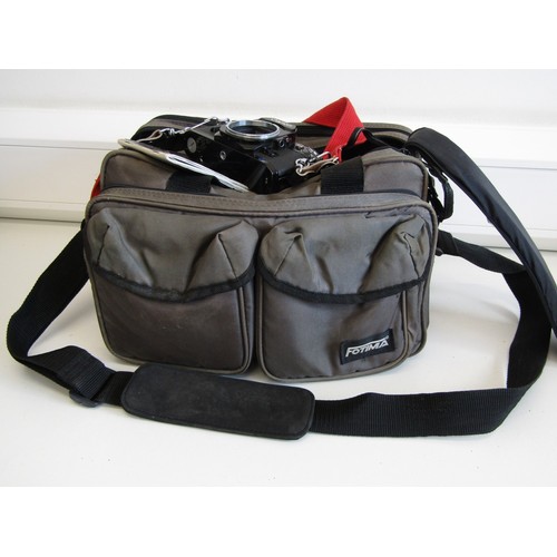 43 - Canon AE-1 camera with lens, accessories and carry case