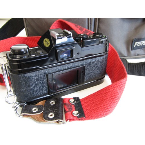 43 - Canon AE-1 camera with lens, accessories and carry case