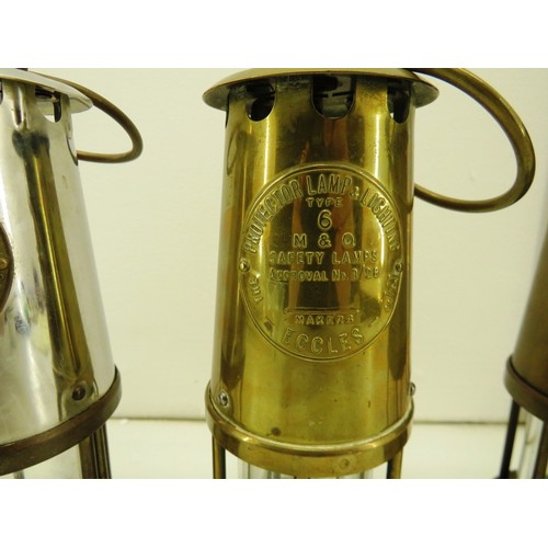 57 - Three full size miner's lamps