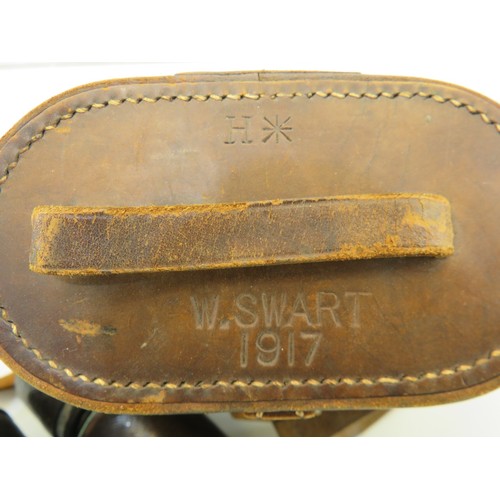 31 - Le Maire binoculars in a brown leather case stamped W.Smart 1917