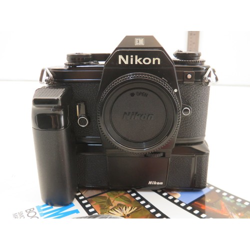 19 - Nikon EM camera with booklet