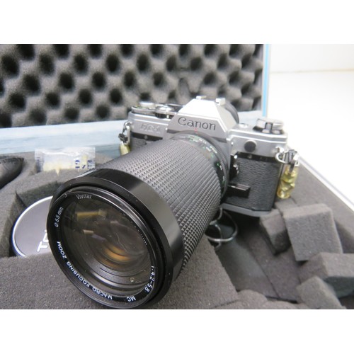 53 - Canon AE-1 camera with lenses and accessories in a flight case
