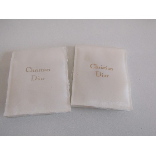 20 - Three Christian Dior stick pins and box.