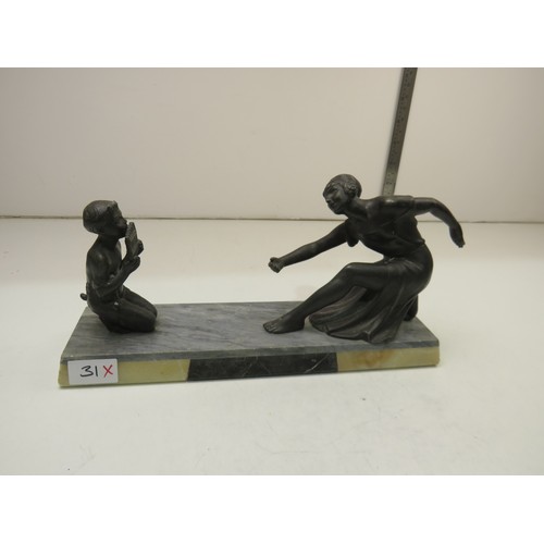 31 - Statue of woman and child on marble base.