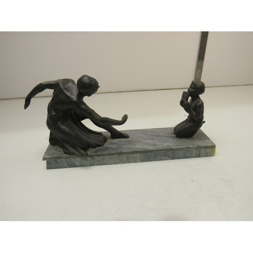 31 - Statue of woman and child on marble base.