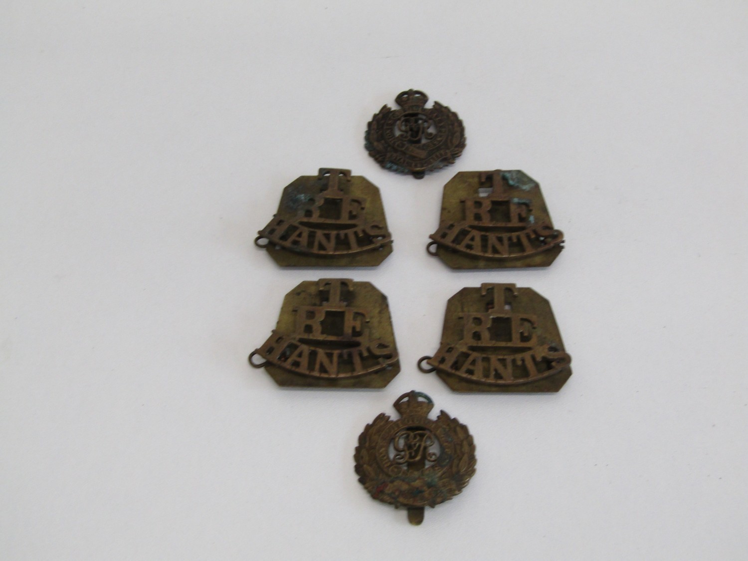 A collection of WWI British military insignia, comprising four scarce ...