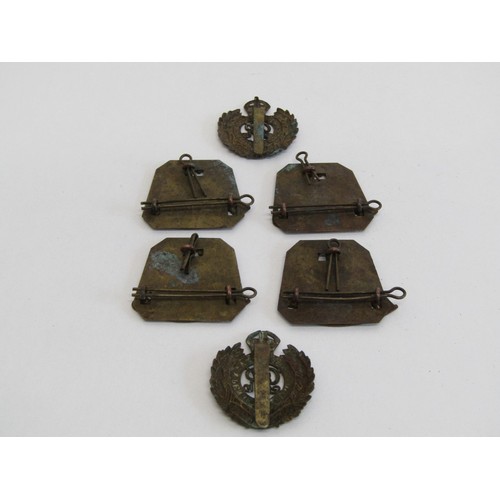 A collection of WWI British military insignia, comprising four scarce ...