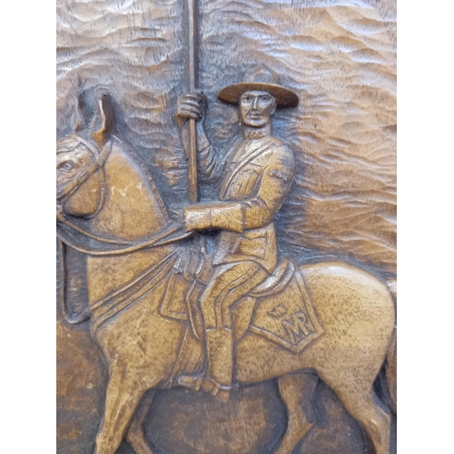 40 - Circular wooden plaque of a Canadian Mountie