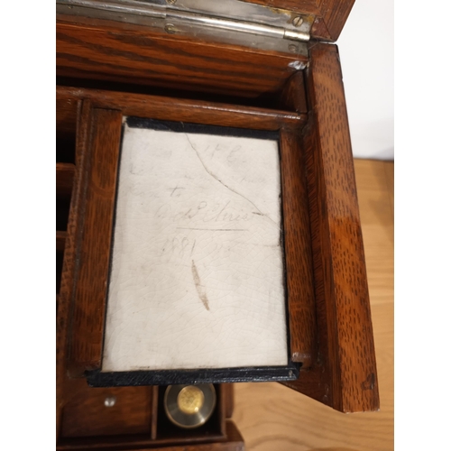 67 - Victorian Oak Travelling Writing box with Slope, brass handles, convex top ink wells, drawers etc.