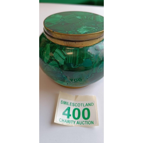 400 - Malachite lidded pot approx diameter 10 cm with brass surrounds.