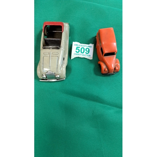 509 - 2 vintage Tri-ang model cars , both wind up (wynd) see photos