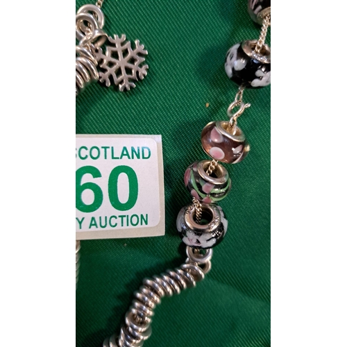 560 - 2 necklaces and a bracelet marked Links of London