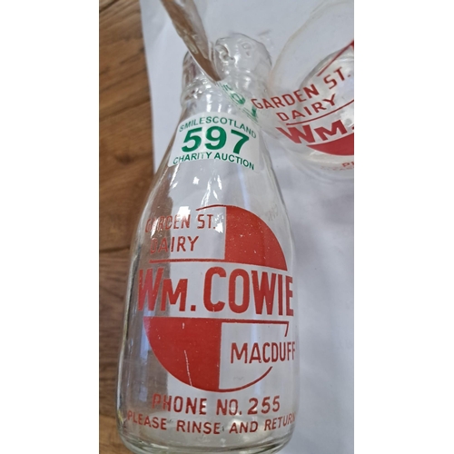 597 - a pair of vintage 1/2 pint milk bottles from Wm Cowie Macduff .