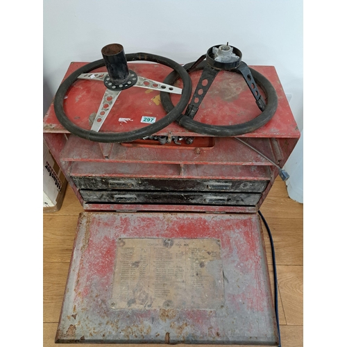 297 - Red metal tool box with some tools and 2 steering wheels