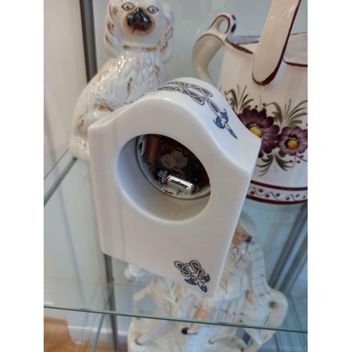 151 - Porcelain watering can clock and a wally dug