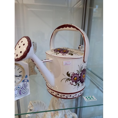 151 - Porcelain watering can clock and a wally dug