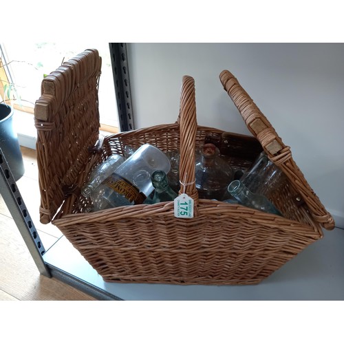 175 - Wicker basket with collectible bottles