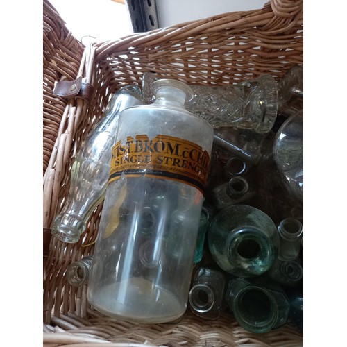 175 - Wicker basket with collectible bottles