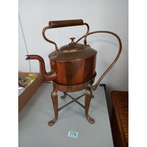 179 - Copper kettle on a heating stand