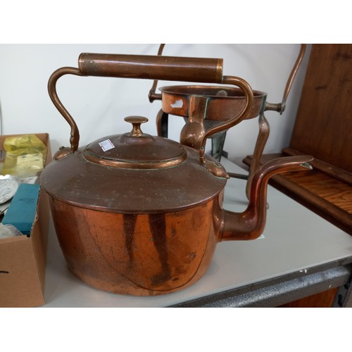 179 - Copper kettle on a heating stand