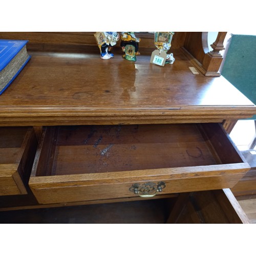 186 - Oak dresser with mirror and book storage