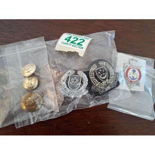 422 - A selection of Military badges etc