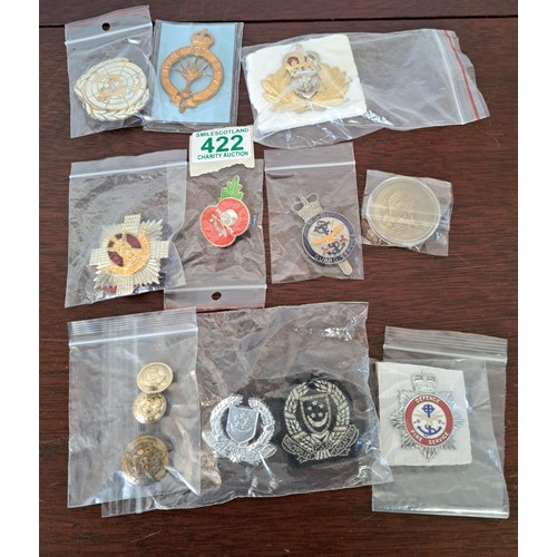 422 - A selection of Military badges etc