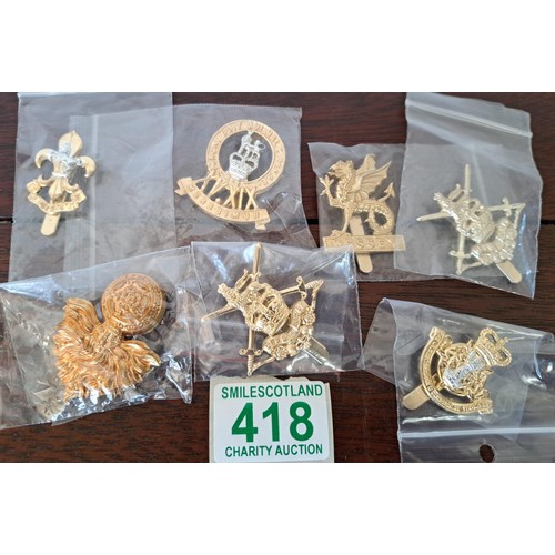 418 - A selection of Military Badges