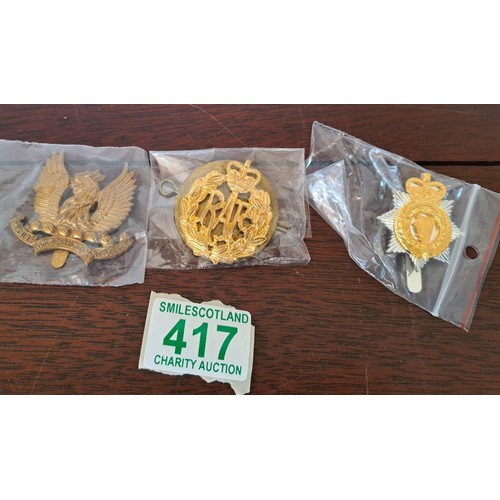 417 - A selection of Military badges