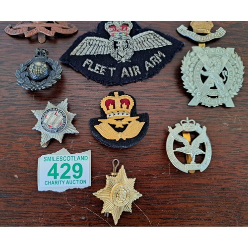 429 - A selection of military badges