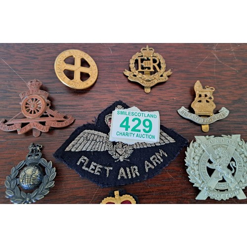 429 - A selection of military badges