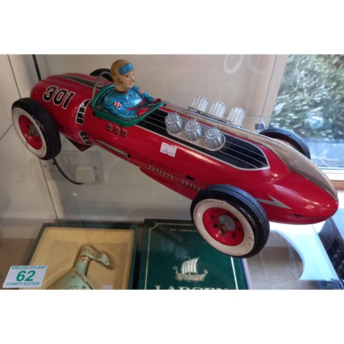 62 - Vintage battery operated tin toy racing car made in Japan 50cm approx.