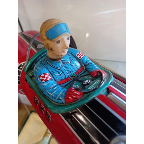 62 - Vintage battery operated tin toy racing car made in Japan 50cm approx.