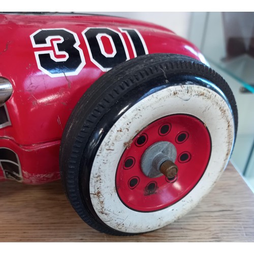 62 - Vintage battery operated tin toy racing car made in Japan 50cm approx.