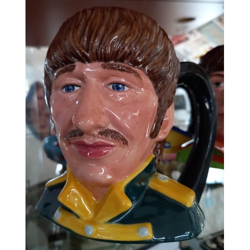 104 - Royal Doulton 1984 'The Beatles' Toby Jugs.  To include: Paul McCartney, John Lennon, Ringo Star and... 