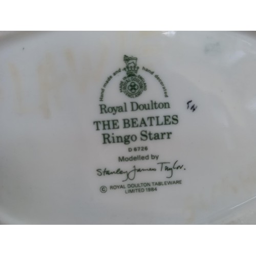 104 - Royal Doulton 1984 'The Beatles' Toby Jugs.  To include: Paul McCartney, John Lennon, Ringo Star and... 