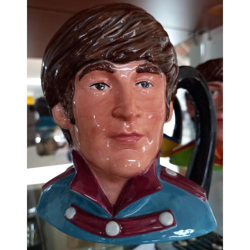 104 - Royal Doulton 1984 'The Beatles' Toby Jugs.  To include: Paul McCartney, John Lennon, Ringo Star and... 