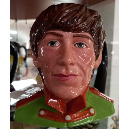 104 - Royal Doulton 1984 'The Beatles' Toby Jugs.  To include: Paul McCartney, John Lennon, Ringo Star and... 