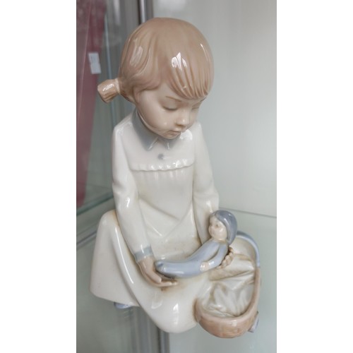 158 - Rare Nao child with doll and cradle & Royal Doulton darling HN1985