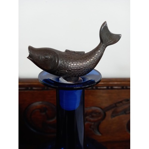 198 - Blue glass decanter with a replacement fish top pourer.