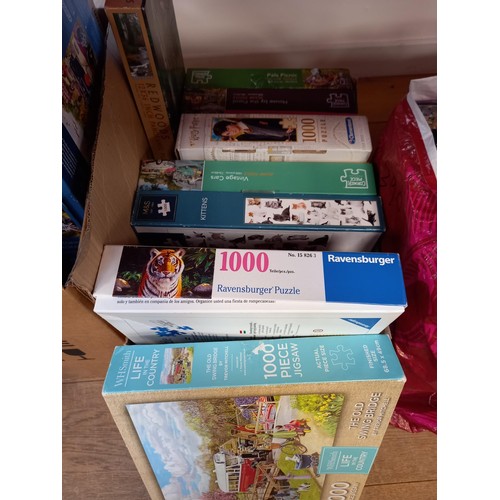 217 - Two boxes and one bag of Jigsaw puzzles