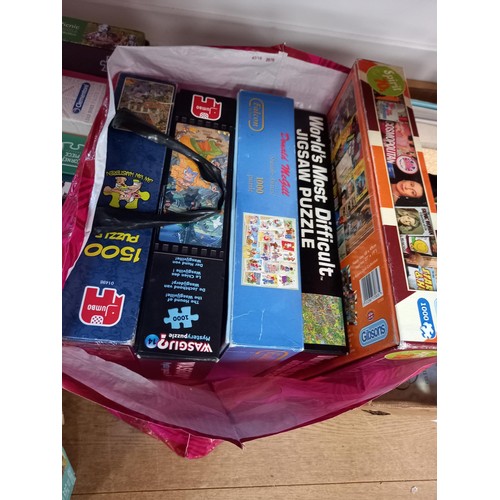 217 - Two boxes and one bag of Jigsaw puzzles