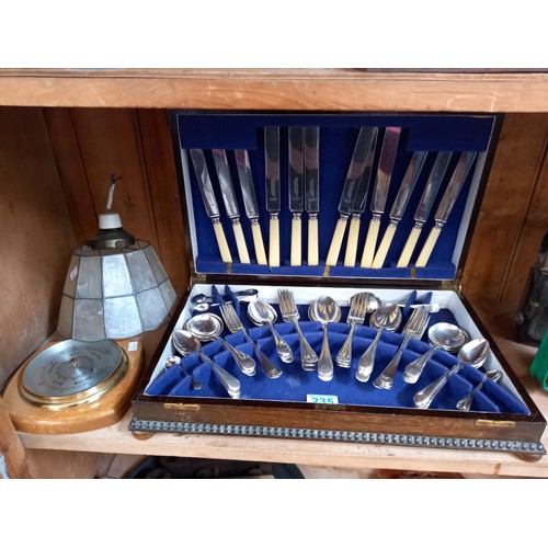 235 - Boxed cutlery, barometer and lamp shade