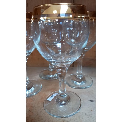 240 - 4 red and 4 white gold rimmed wine glasses