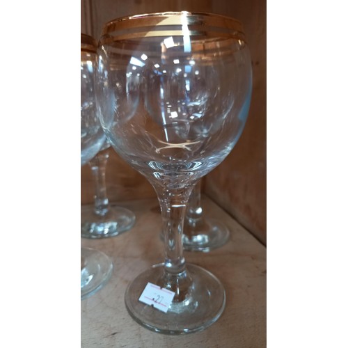 240 - 4 red and 4 white gold rimmed wine glasses