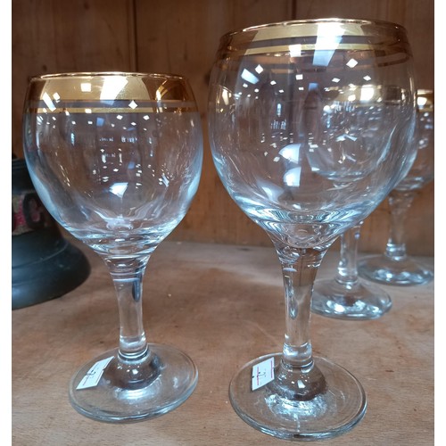 240 - 4 red and 4 white gold rimmed wine glasses